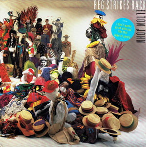 ELTON JOHN | REG STRIKES BACK - US PRESS