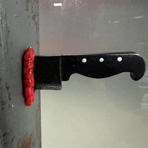KNIFE STABBING FRIDGE MAGNET