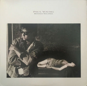 PAUL YOUNG | BETWEEN TWO FIRES